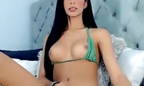 long haired brazilian tranny goddess tugs her penis on