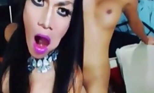 Two stunning trannies moan as they fuck each other assholes