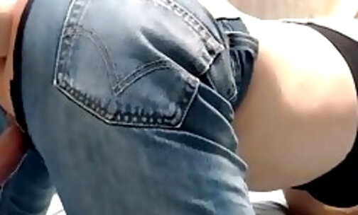 Tranny in ripped jeans fucking her ass on her suction dildo