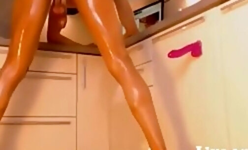Tall oiledup shemale masturbates on the kitchen counter