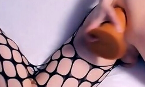 Very sexy tranny in fishnets fisting and dildoing her ass