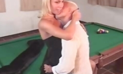 Leggy blond shemale fucking on a table