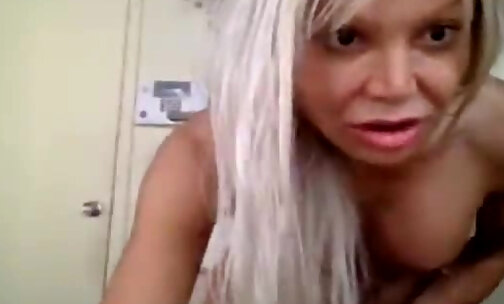 Blonde TS tugs her dick on webcam