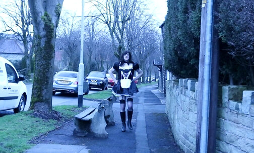 crossdressed as a French maid out on the street