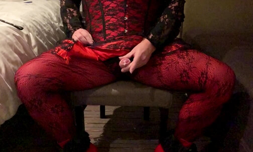 Crossdresser cums in red and black outfit