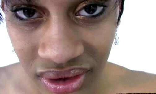 Ebony T-girl with big lips gets her black cock jerked in POV