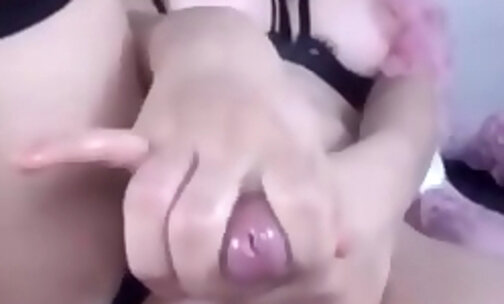 Pink haired shemale plays with her ass and shecock