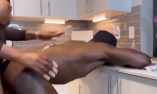 Busty black tranny fucking a dude's ass in the kitchen